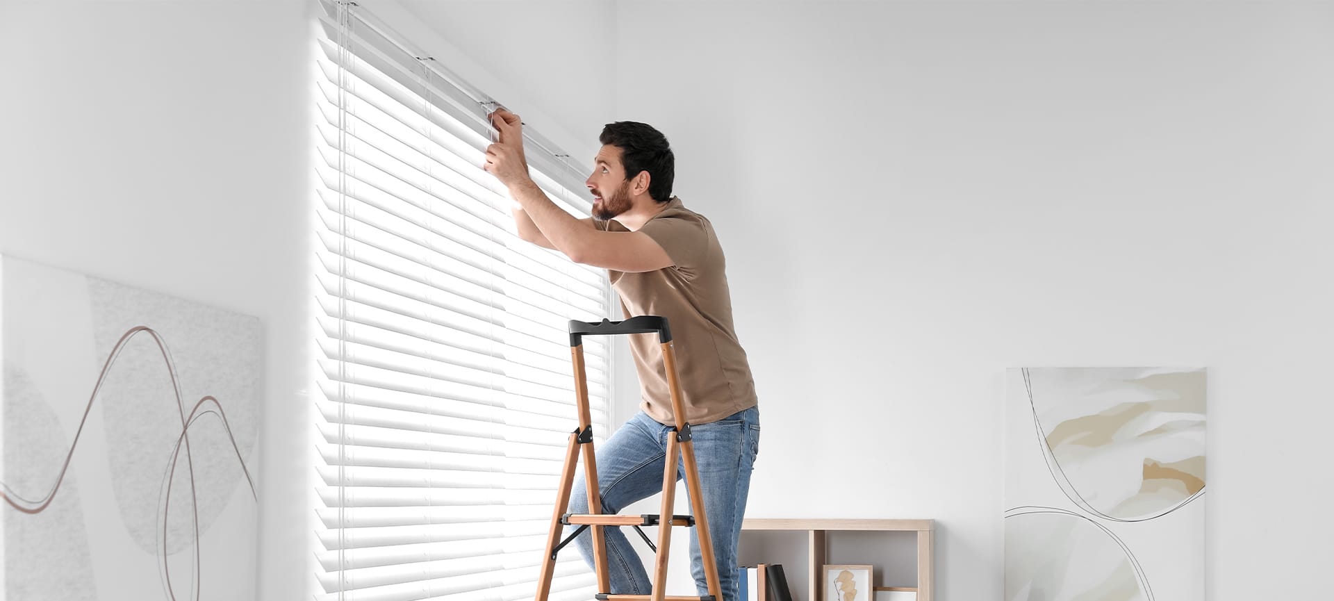 man installing window blind