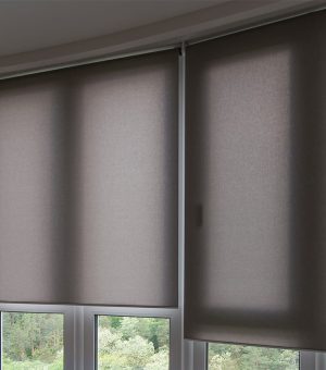 automatic roller blinds beige color on big glass windows