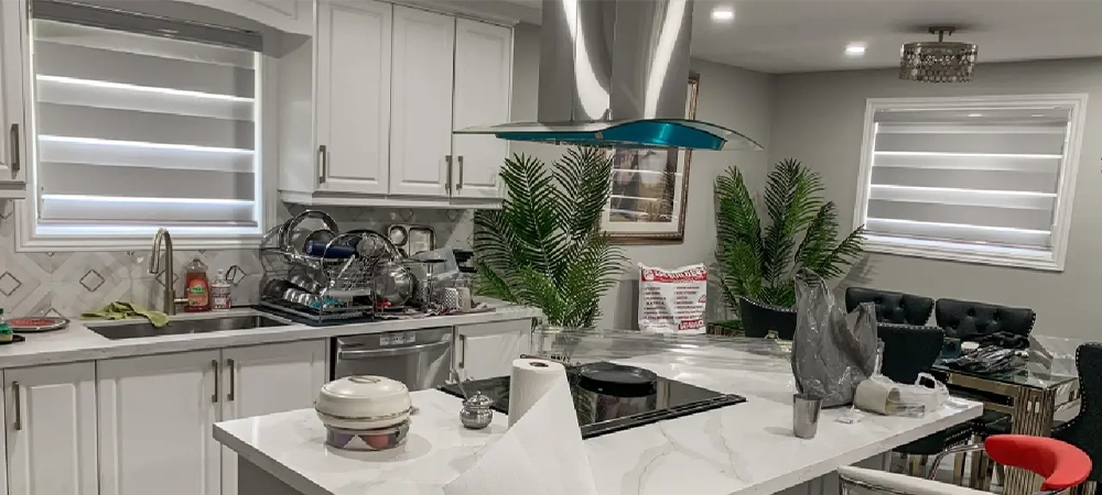 zebra blind on kitchen window, luxury kitchen with white cabinets