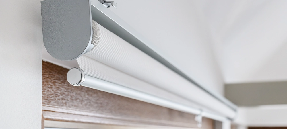 Roller blinds on apartment window, closeup with selective focus