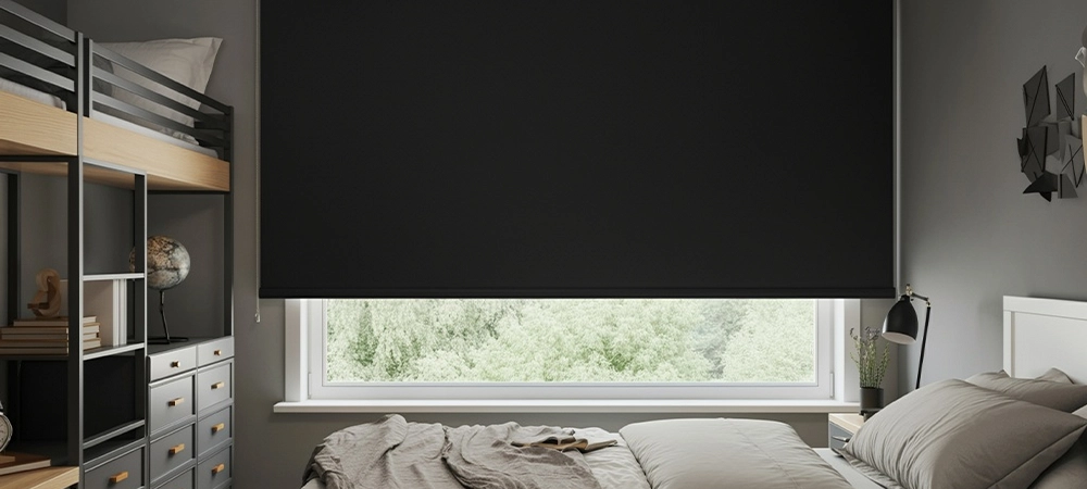 Plush bedroom scene of a roller blackout in a window of a dormitory very comfortable with modern furniture