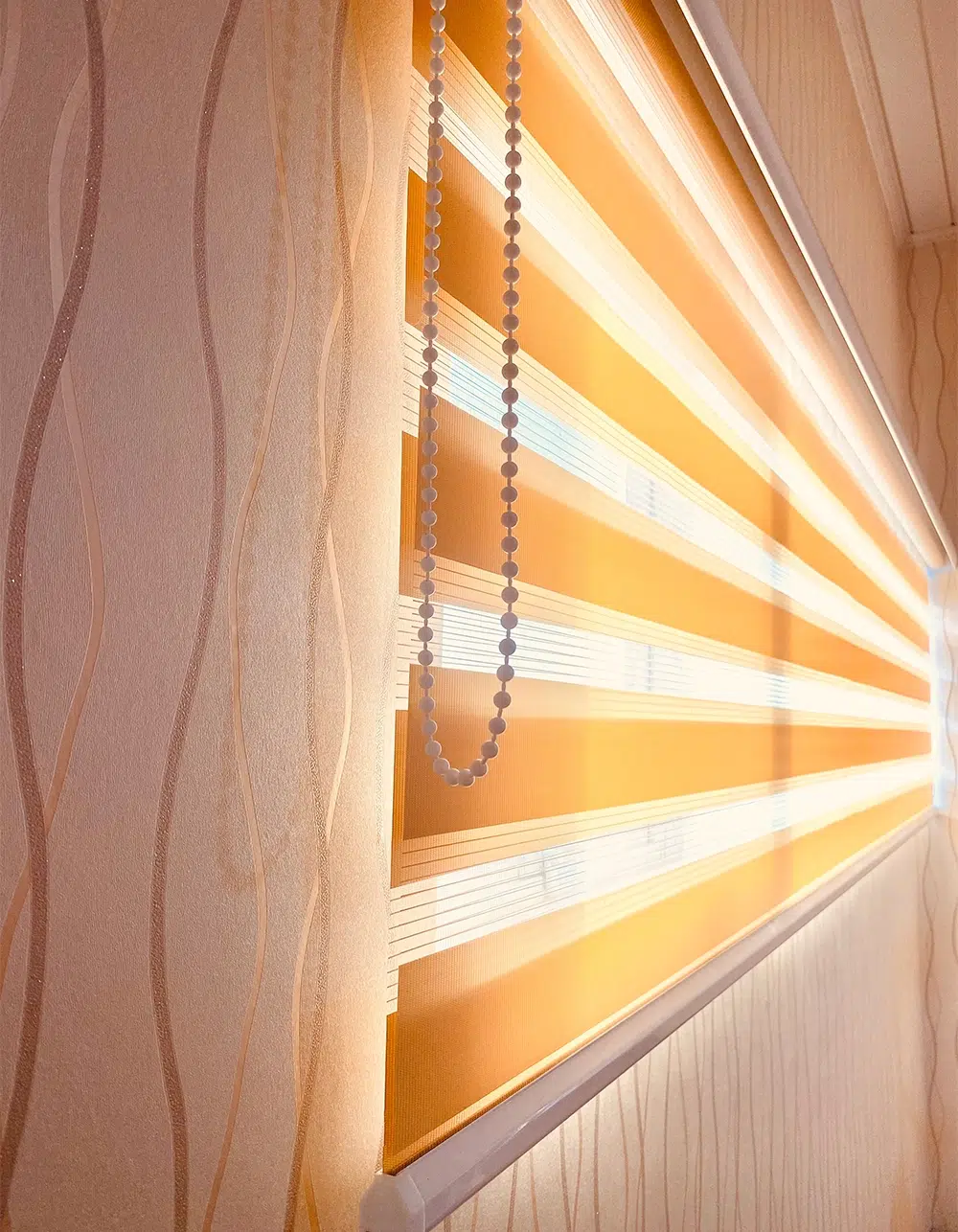 Morning sunlight passing through the zebra blinds