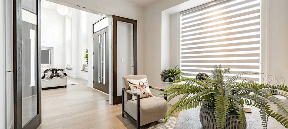 Home office with glass french doors desk globe clock and large windows with blinds