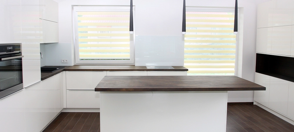 Modern white kitchen with solid wood tabletops