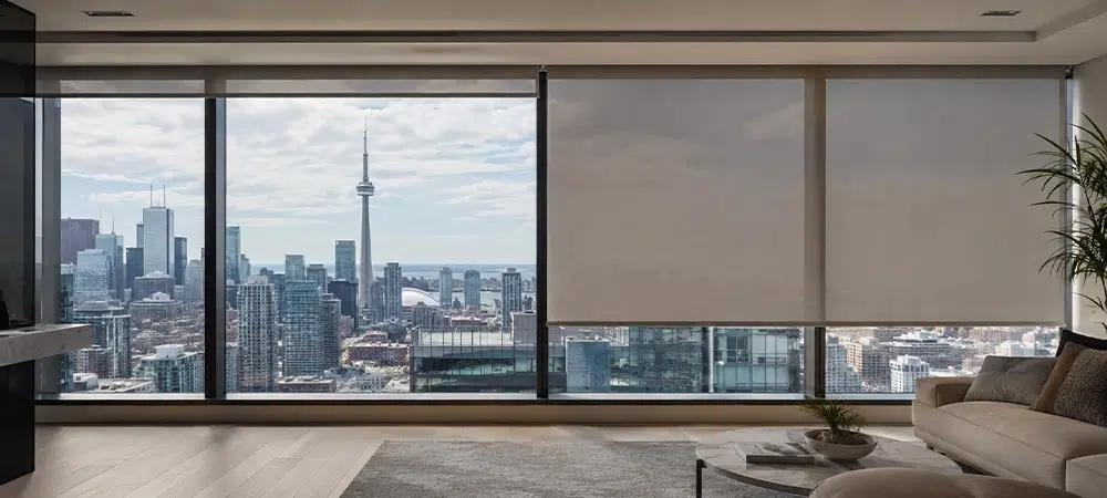 Modern Toronto condo with floor to ceiling windows and motorize blinds overlooking the city skyline.